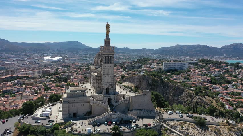 Video from a drone flying over the Basilica of Notre-Dame of la Garde over the city of Marseille, France, Provence on a sunny clear day