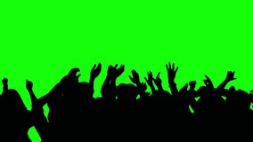 Crowd silhouette of people at a club concert or sports event. Green screen for compositing and presentation. - Powered by Shutterstock - Get 15% off with code: PIKWIZARD15