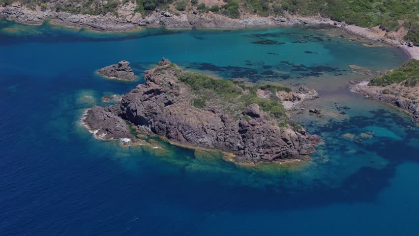 Aerial view of a Sardinian lagoon with cristal clear blue water