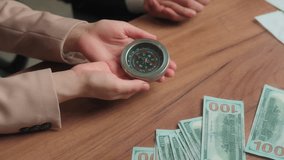 Multiracial office partners Arabian businessman businesswoman male female man muslim woman in hijab hold compass business direction investment stock market financial navigation search money success - Powered by Shutterstock - Get 15% off with code: PIKWIZARD15