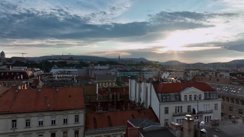 Amazing sunset over Budapest city. Downtown buildings roofs in this video. Colorful sundown on the background
