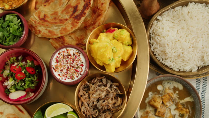 Savor a flavorful bowl of delicious spicy curry, ready to be enjoyed with a spoon