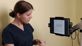 Heart disease, Patient assessment, Patient analytics. Medical professional in clinic setting examines detailed graphs and data on touchscreen monitor to track patient's rehabilitation progress - Powered by Shutterstock - Get 15% off with code: PIKWIZARD15