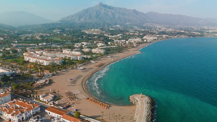 Aerial view of the luxurious Marbella resort town, Costa del Sol, Andalusia, Spain. Popular luxury and exclusive area of Marbella. Beautiful sunset view of the famous Spanish holiday destination