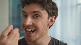 Close up face happy Caucasian man eating salad vegetables vegan enjoy healthy food guy sportsman dieting tasting vitamin delicious nutrition calories balanced refreshing activity lifestyle smile male - Powered by Shutterstock - Get 15% off with code: PIKWIZARD15