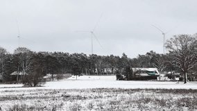 Winter Wonderland Scenic Snowy Countryside with Wind Turbines in a Rural Landscape - Powered by Shutterstock - Get 15% off with code: PIKWIZARD15