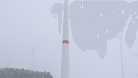 Wind turbines operate well in snowy winter weather, harnessing renewable energy efficiently - Powered by Shutterstock - Get 15% off with code: PIKWIZARD15