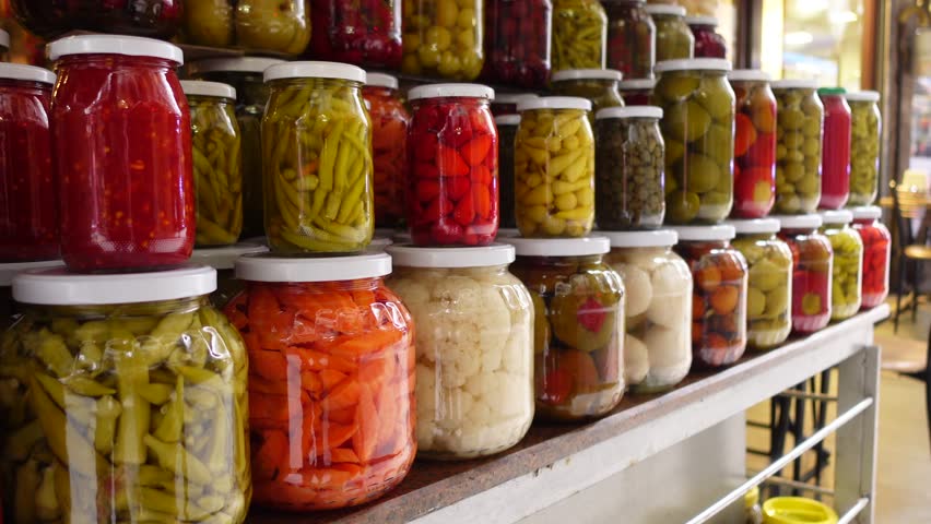 Canned fruits and vegetables in glass jars