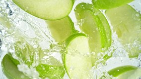 Super Slow Motion Shot of Green Apple Cuts Followed by Camera Splashing into Water at 1000 fps. - Powered by Shutterstock - Get 15% off with code: PIKWIZARD15