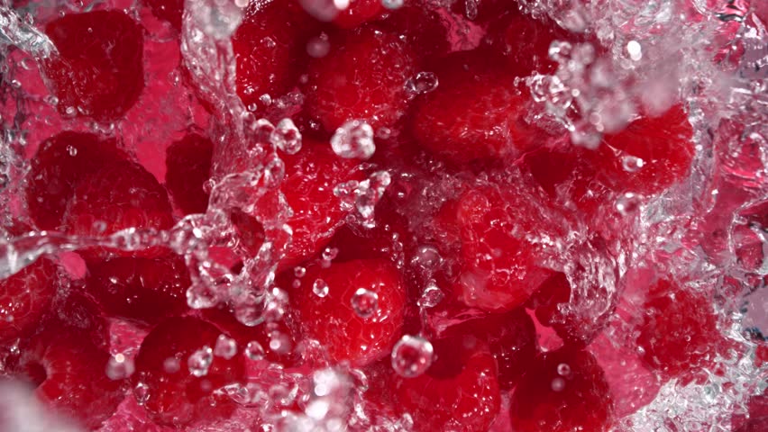 Super Slow Motion Shot of Raspberries Followed by Camera Splashing into Water at 1000 fps. - Powered by Shutterstock - Get 15% off with code: PIKWIZARD15