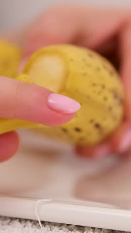peel a banana slides over a banana while I peel it, a bunch of yellow bananas against a blue sky. Dolly slider extreme close-up. Laowa Probe
