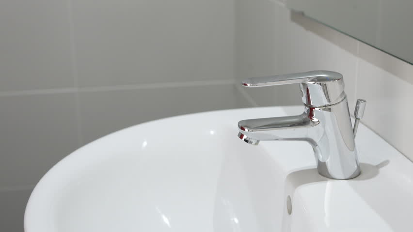 Woman's hands, toothbrush and person at tap for water, dental hygiene and gum care at home. Closeup, brushing teeth and rinse oral product for fresh grooming, morning routine and cleaning at bathroom 