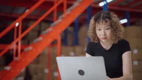 Two warehouse employees collaborating on inventory management, using a laptop and clipboard, standing in a well-organized warehouse. - Powered by Shutterstock - Get 15% off with code: PIKWIZARD15