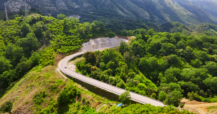 Aerial view of a road through a countryside landscape in Vlore, southern Albania. 