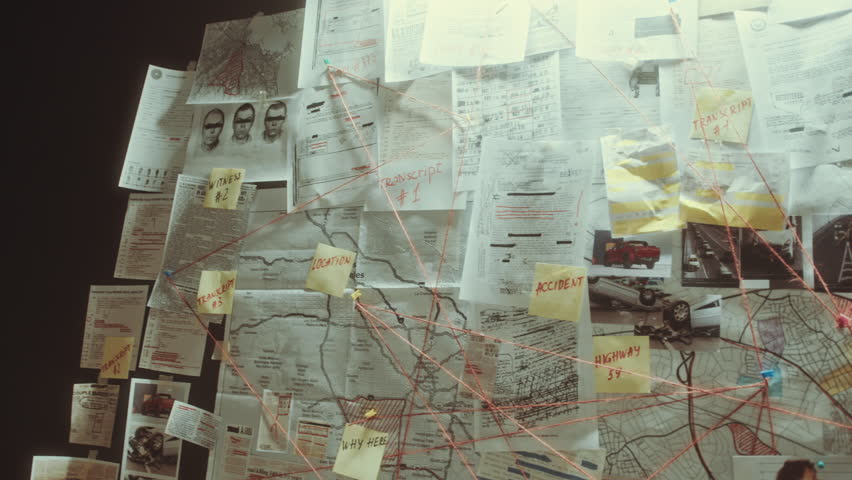 Close-up view of criminal investigation board with clues, mugshots, maps, forensic sketches, newspaper articles and sticky notes connected with thread in detective office