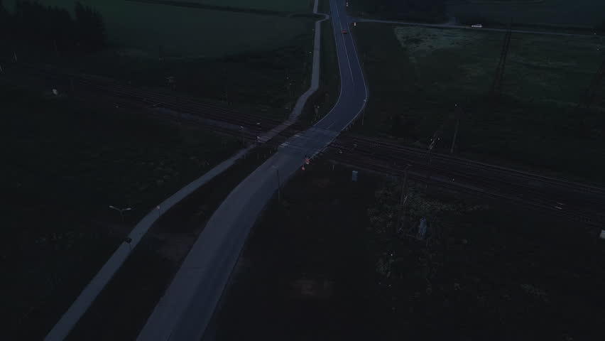Aerial View of Rural Roads at Twilight captures the serene countryside landscape from an elevated perspective at dusk