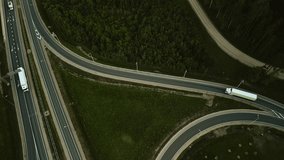 Aerial view of trucks on highway interchange shows realtime traffic flow, logistics, transport, and urban planning - Powered by Shutterstock - Get 15% off with code: PIKWIZARD15