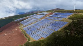 Solar panel and wind turbines on the island of Madeira, energy transition to renewable sources. Clean energy for sustainable development and reduces the carbon footprint on this picturesque island - Powered by Shutterstock - Get 15% off with code: PIKWIZARD15