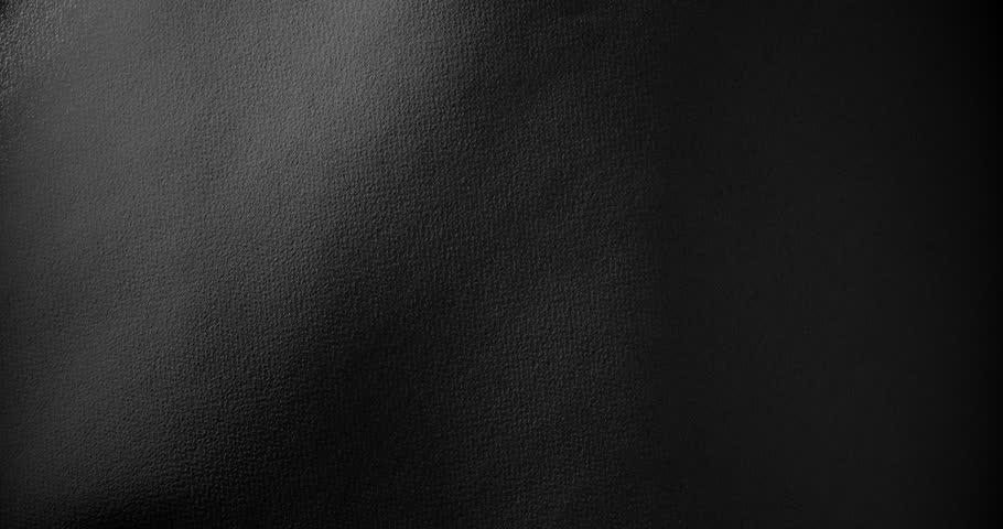 Black rough paper surface, slow moving. Use for background and texture.
