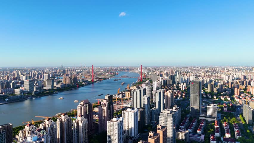 Aerial view of Shanghai, showcasing the Pudong Lujiazui Financial Area. Highlights the concept of modern urban development and economic power in China