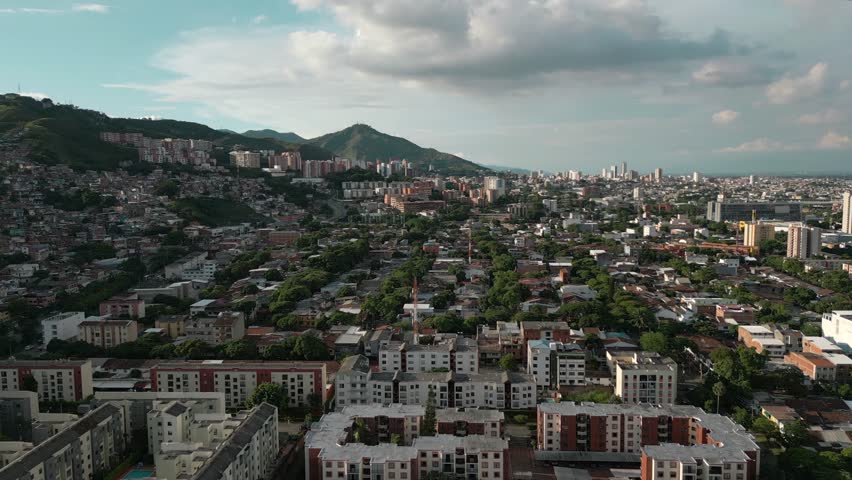 Aerial View of El Lido Tequendama Neighborhood, Cali Colombia. Pull Back Shot with Three Crosses Hill in the Background
