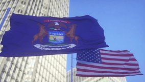 Michigan and American Flag waving in sky. High detailed waving flag of Michigan and USA. Michigan state flag, Flag of state Michigan. USA. 3D render - Powered by Shutterstock - Get 15% off with code: PIKWIZARD15