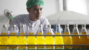 Employee is working at beverage factory. Technology and beverage production factory. - Powered by Shutterstock - Get 15% off with code: PIKWIZARD15