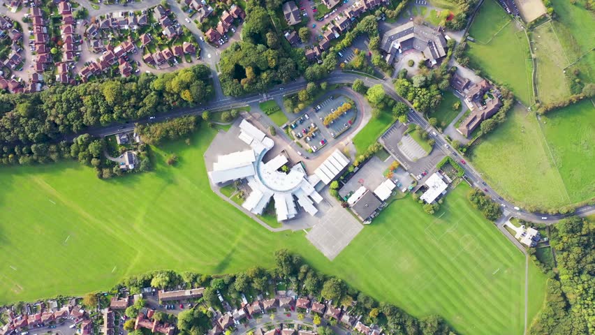Aerial drone footage of the Cardinal Heenan Catholic High School, a comprehensive high school located in Meanwood, Leeds, West Yorkshire England in the summer time