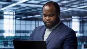 Software developer in data center runs diagnostic tests and error checking utilities on laptop to fix problems. IT expert looking for network issues affecting rigs performance using notebook, camera A - Powered by Shutterstock - Get 15% off with code: PIKWIZARD15