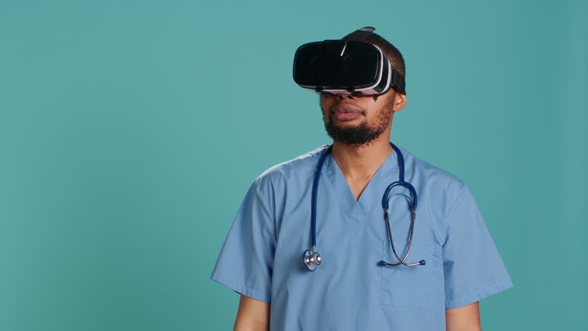 Nurse wearing virtual reality headset remotely operating patient. Healthcare specialist using high tech futuristic modern medical vr gadget, isolated over blue studio background, camera A - Powered by Shutterstock - Get 15% off with code: PIKWIZARD15