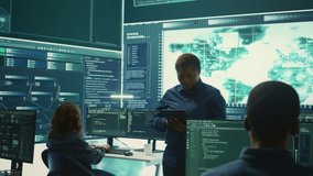 Governmental agency cyber defense team analyzing cyber attacks. IT security professionals working to prevent data breaches and protect against cybercrime, securing digital information. Camera B. - Powered by Shutterstock - Get 15% off with code: PIKWIZARD15