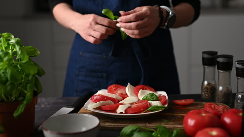 Chief Apron-Clad Girl Decorating Tasty Traditional Caprese Salad