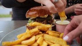 Family Enjoying French Fries, Burger And Sauce - Powered by Shutterstock - Get 15% off with code: PIKWIZARD15