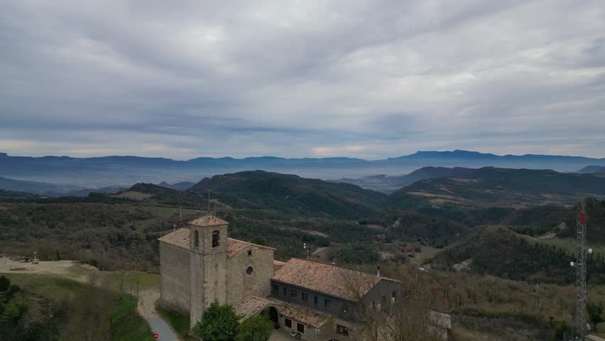 Church of sant pere de casserres with surrounding mountains in barcelona, spain, aerial view