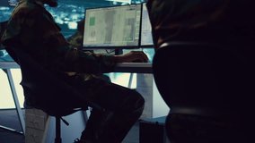 Soldier implements and processes tactical data with reconnaissance radar system, creating comprehensive battlefield maps to aid troops in the operational field. Intelligence for a mission. Camera B. - Powered by Shutterstock - Get 15% off with code: PIKWIZARD15