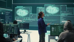 Group of professional hackers gaining access into government database to steal important information for hybrid warfare. Experts work on scams and phishing activity in high tech office. Camera B. - Powered by Shutterstock - Get 15% off with code: PIKWIZARD15