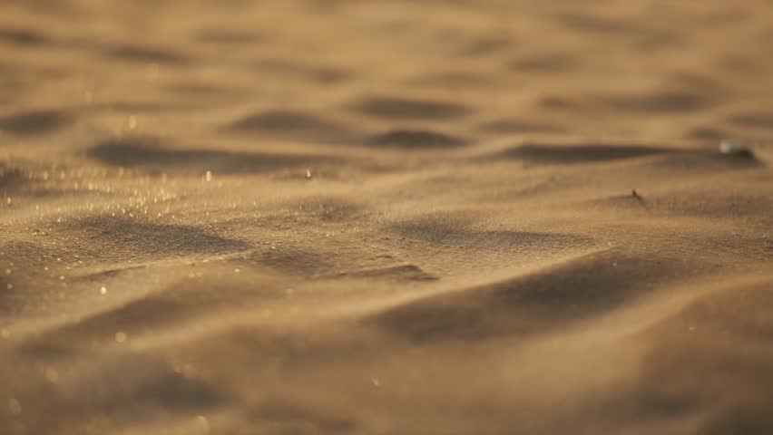 Low close up shot of sand dunes forming in the wind