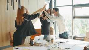 Team Celebrates Success with a Joyful Gathering at the Office, marking their accomplishment and teamwork. Colleagues join together in a positive and enthusiastic atmosphere - Powered by Shutterstock - Get 15% off with code: PIKWIZARD15