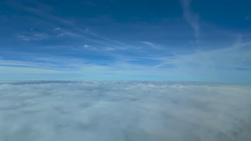 Unique pilot POV hyperlapse flying across a layer of stratus. Daylight, 4K. Immersive pilot view.