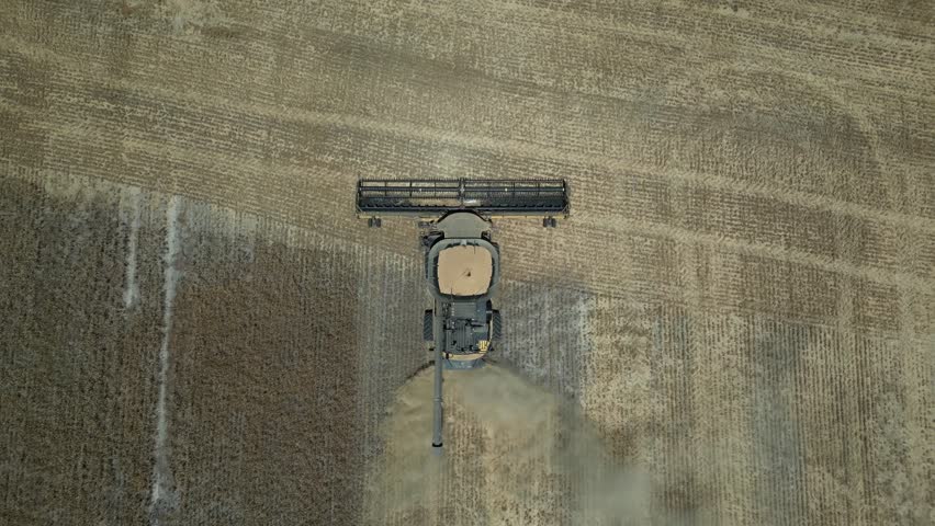 Overhead Shot Of Tractor Harvesting Wheat, Grain Harvest Industry, Esperance Area, Western Australia