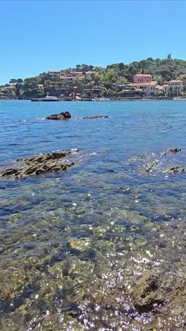High definition vertical video of Collioure Beach, Plage de Collioure and its clear sea waters, a picturesque french town on the Mediterranean coast of Southern France