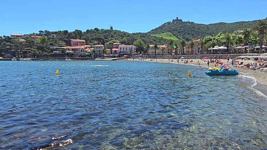High definition video of people at Collioure Beach, Plage de Collioure, a picturesque french town on the Mediterranean coast of Southern France