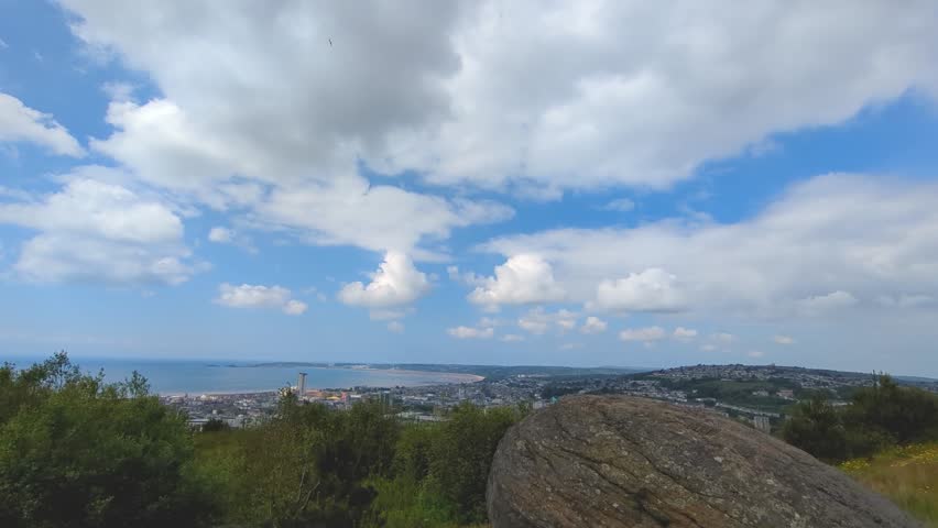 Timelapse of Clouds Passing Above Swansea Cityscape with Curved Beach Bay and Skyscrapers