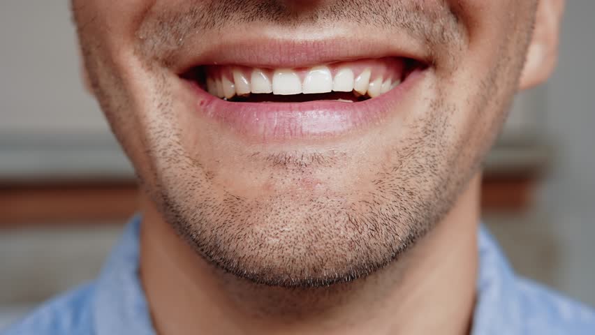 Portrait of Young Man Smiling on Camera in Cropped Closeup Shot. One Beautiful Face of Happy Male Person Indoors at Abstract Home. Wonderful Inspiration in Optimism of Successful Adult Guy Close-Up 4k