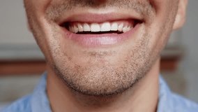 Portrait of Young Man Smiling on Camera in Cropped Closeup Shot. One Beautiful Face of Happy Male Person Indoors at Abstract Home. Wonderful Inspiration in Optimism of Successful Adult Guy Close-Up 4k - Powered by Shutterstock - Get 15% off with code: PIKWIZARD15
