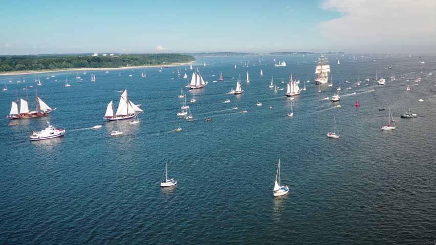 Tall ships passing Kieler Förde to Kiel week. Parade of sailing ships during Kiel Week, Kiel Fjord, Schleswig-Holstein, Germany.