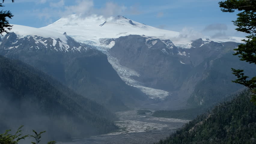 Glacier in Chilean Patagonia and snow capped mountains