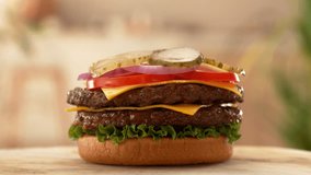 Stacking Hamburger Pieces. Camera in Motion. Camera Placed on Motion Control System. Beautiful Bokeh Kitchen Background. - Powered by Shutterstock - Get 15% off with code: PIKWIZARD15