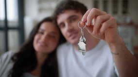 Happy couple pregnant family Caucasian man guy male pregnancy woman girl female smiling kissing check at couch sofa own home relocation showing keys moving day loan mortgage tenant house insurance - Powered by Shutterstock - Get 15% off with code: PIKWIZARD15