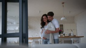Happy loving couple people pregnant family love Caucasian man guy male boyfriend husband hugging cuddling pregnancy belly wife girlfriend woman girl female dancing at home affectionate romantic dance - Powered by Shutterstock - Get 15% off with code: PIKWIZARD15
